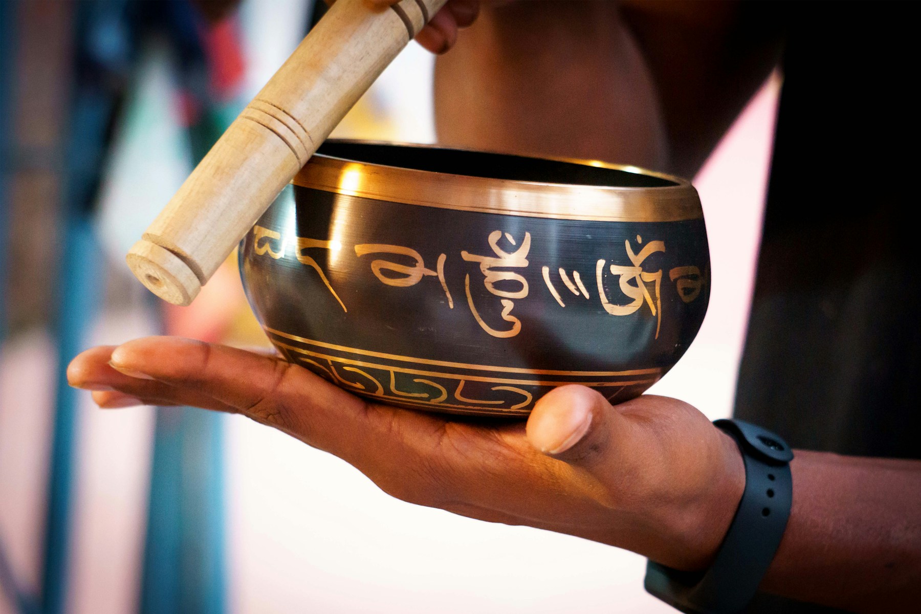 Close-up of the lettering and rim on a singing bowl